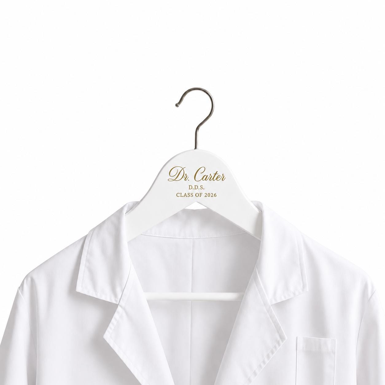 White personalized dentist hanger holding a white coat
