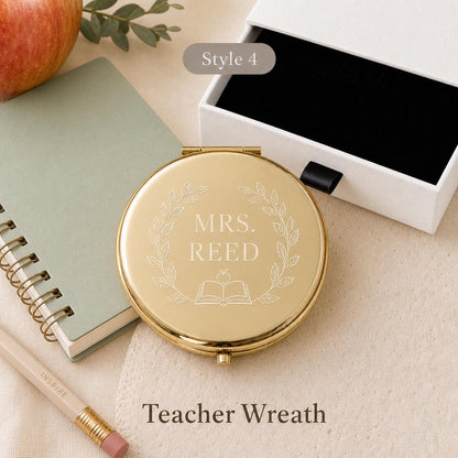 Style 4 botanical wreath compact mirror with a white gift box and black pull tab