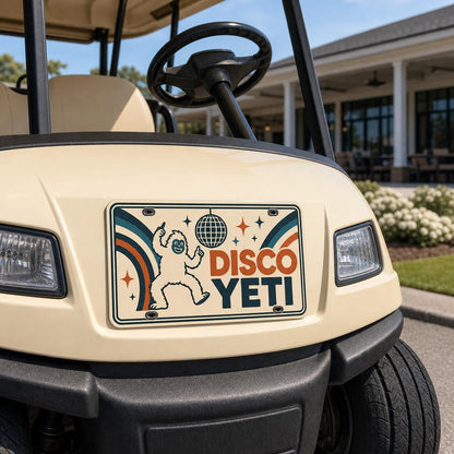 Disco Yeti custom aluminum license plate professionally mounted on the front of a cream golf cart.
