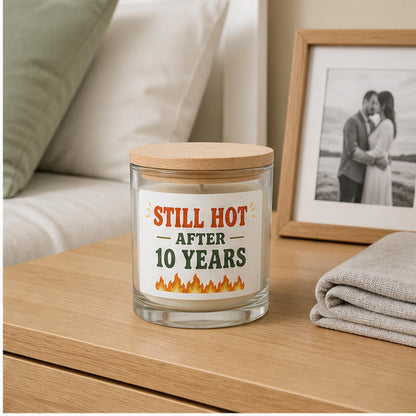 Anniversary candle staged on a bright bedroom nightstand