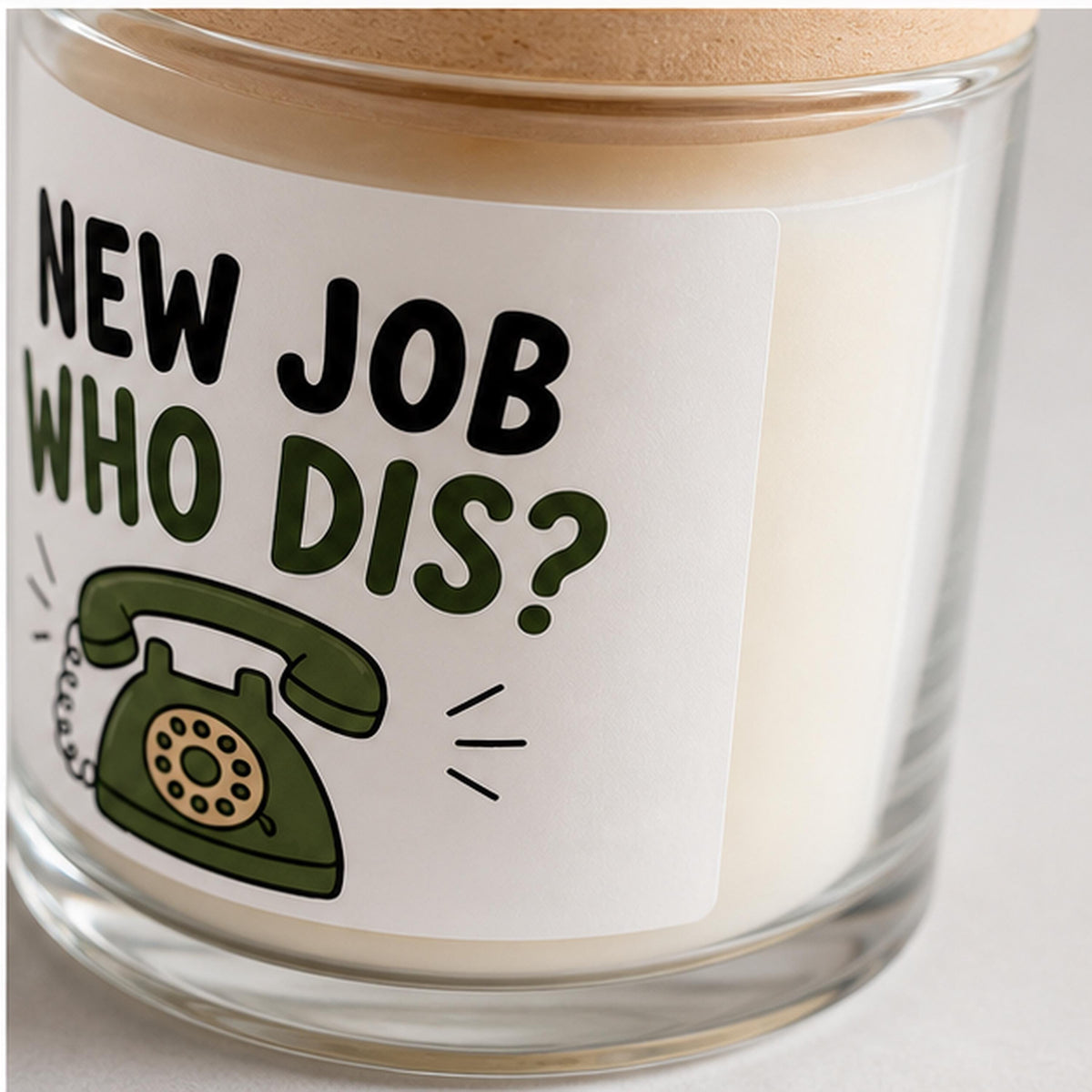 Close detail of a new job candle label applied to glass