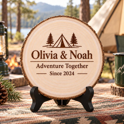 Camping Couple Gift displayed on the optional black wooden stand in a matching setting. Approved thumbnail September 25, 2026.