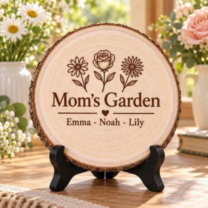 Mom Birth Flower Gift displayed on the optional black wooden stand in a matching setting. Approved thumbnail September 25, 2026.