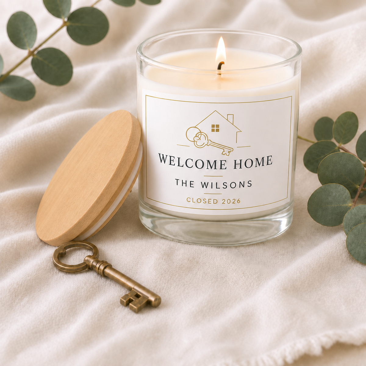 personalized Realtor Closing Candle, Custom New Homeowner Gift, lit with natural wood lid beside the jar